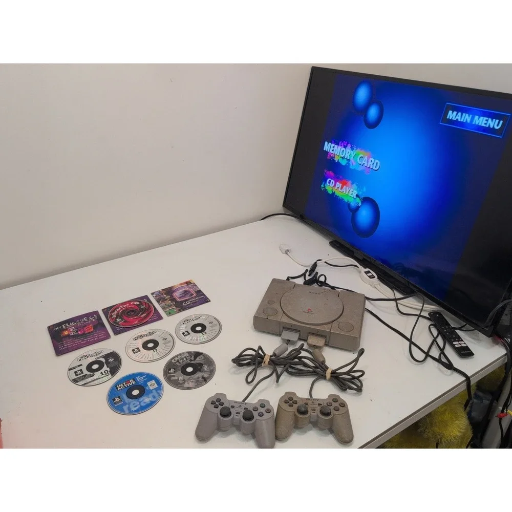 Sony PlayStation 1 Gray  System Tested Working Plus 2 Controllers 8 Games Cords